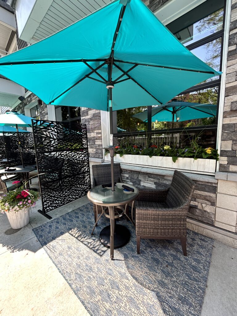 Riverside dining patio at The Tasting Room in downtown Traverse City, overlooking the Boardman River