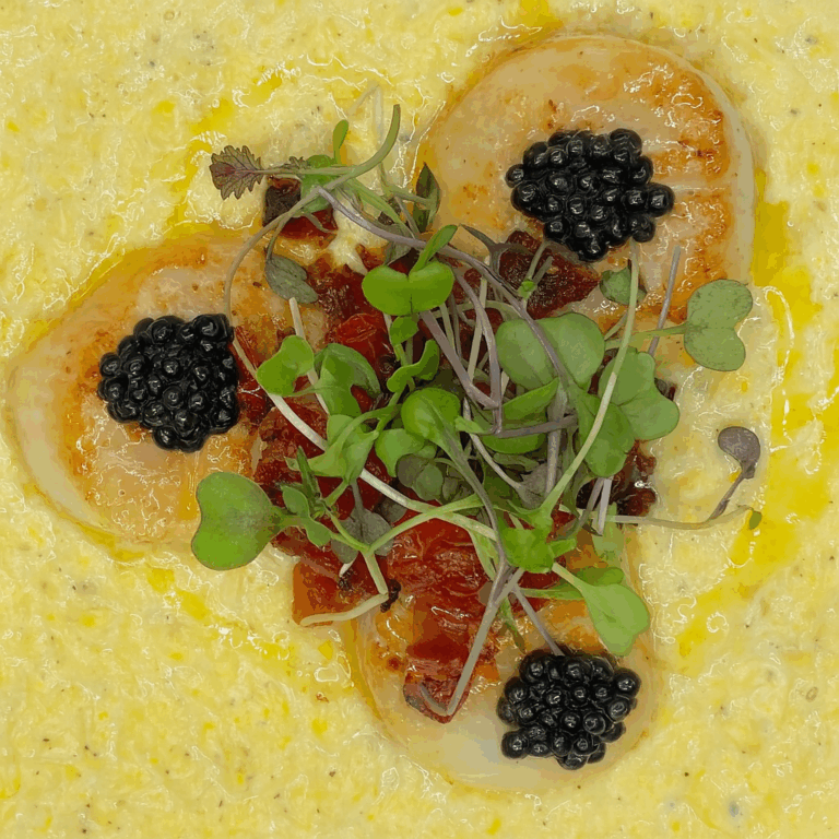 Pan-Seared U15 Scallops with Osetra caviar on sweet cream corn at The Tasting Room in downtown Traverse City