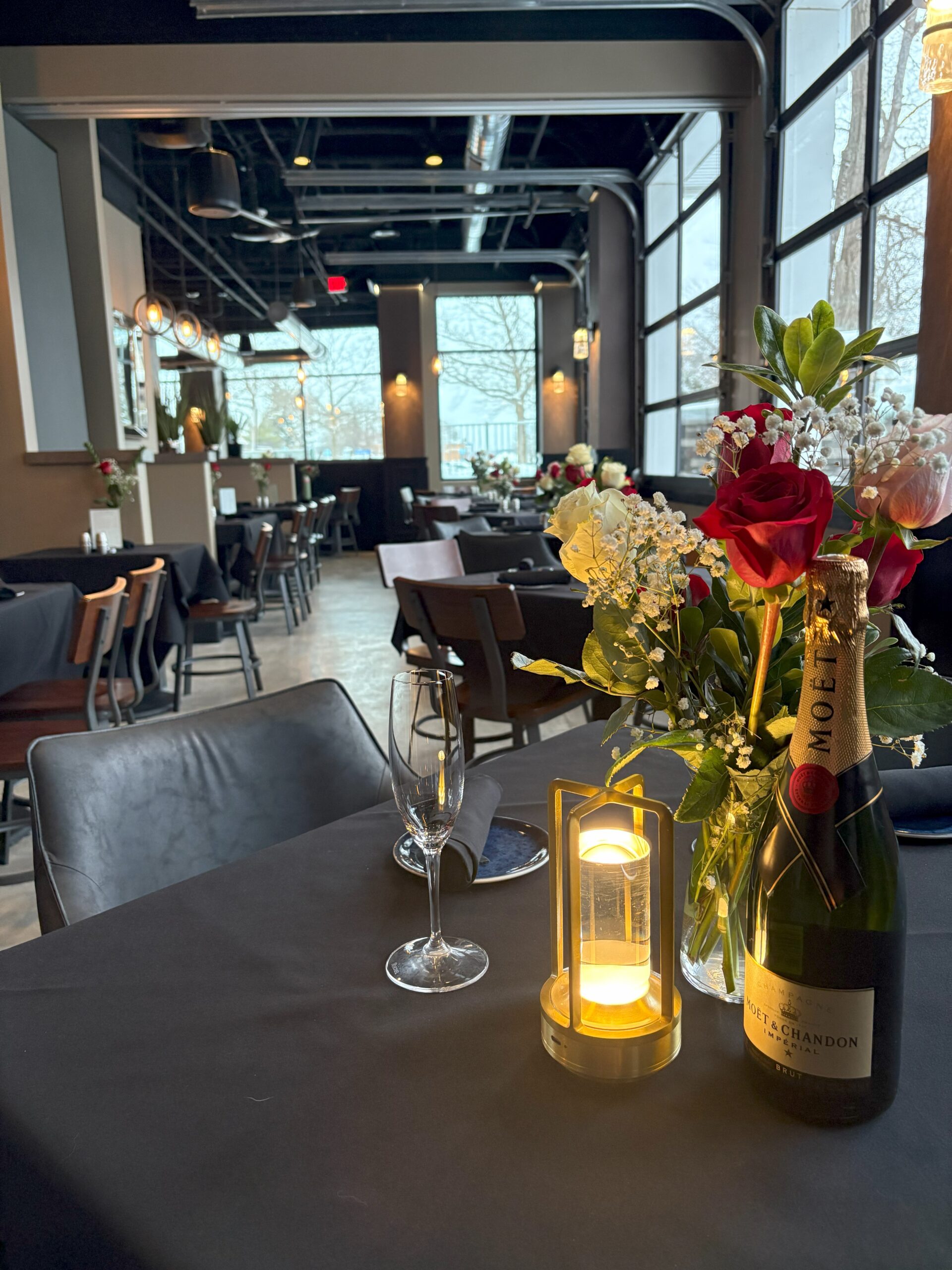Elegant champagne and floral centerpiece for private dining at The Tasting Room in Traverse City